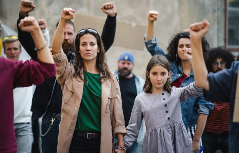 Group of people activists protesting on streets, strike and demonstration concept